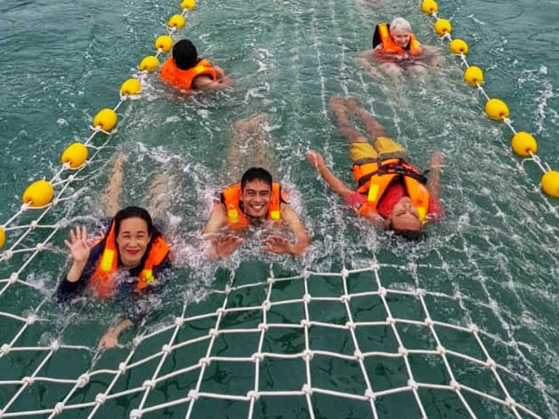 Tourists enjoying water activity while on Langkawi premium cruise